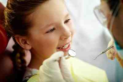 At what age should a child begin seeing a pediatric dentist?