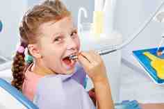 At what age should a child begin seeing a pediatric dentist?