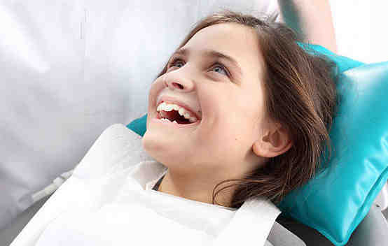 At what age should a child begin seeing a pediatric dentist?