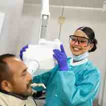 What is the minimum wage for a dental assistant in California?