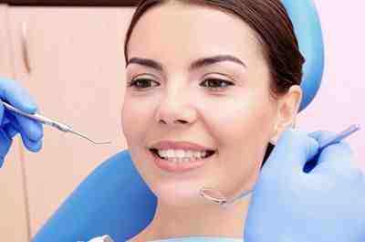 What types of dental procedures are considered an emergency during the COVID-19 pandemic?